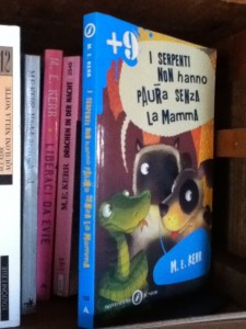 Italian Snakes Don't Miss Their Mothers and other Kerr book spines.